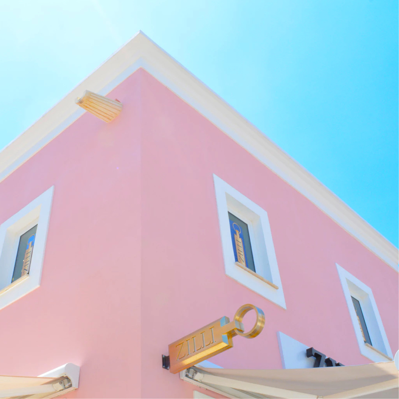 pink building on a sunny day with a clear blue sky in the background